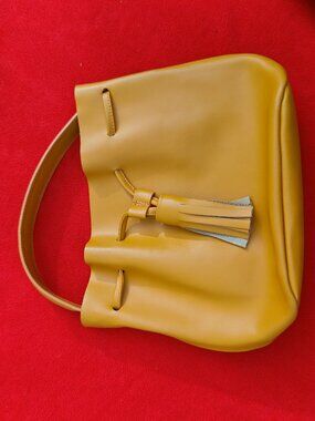 Au Printemps Drawstring Bucket Bag